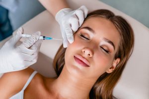 The dermal filler should be injected into the cheeks and lines. Injections of a muscle relaxant will reduce "dynamic" wrinkles, i.e. wrinkles caused by smiling.